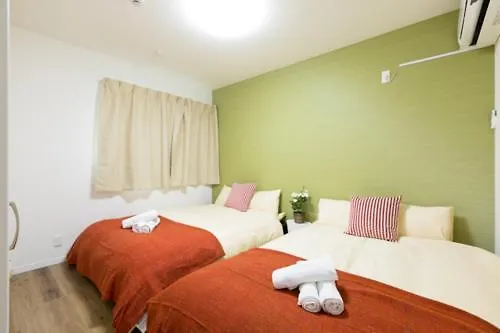 Гостевой дом Отель Ookini House Osaka Dome Япония